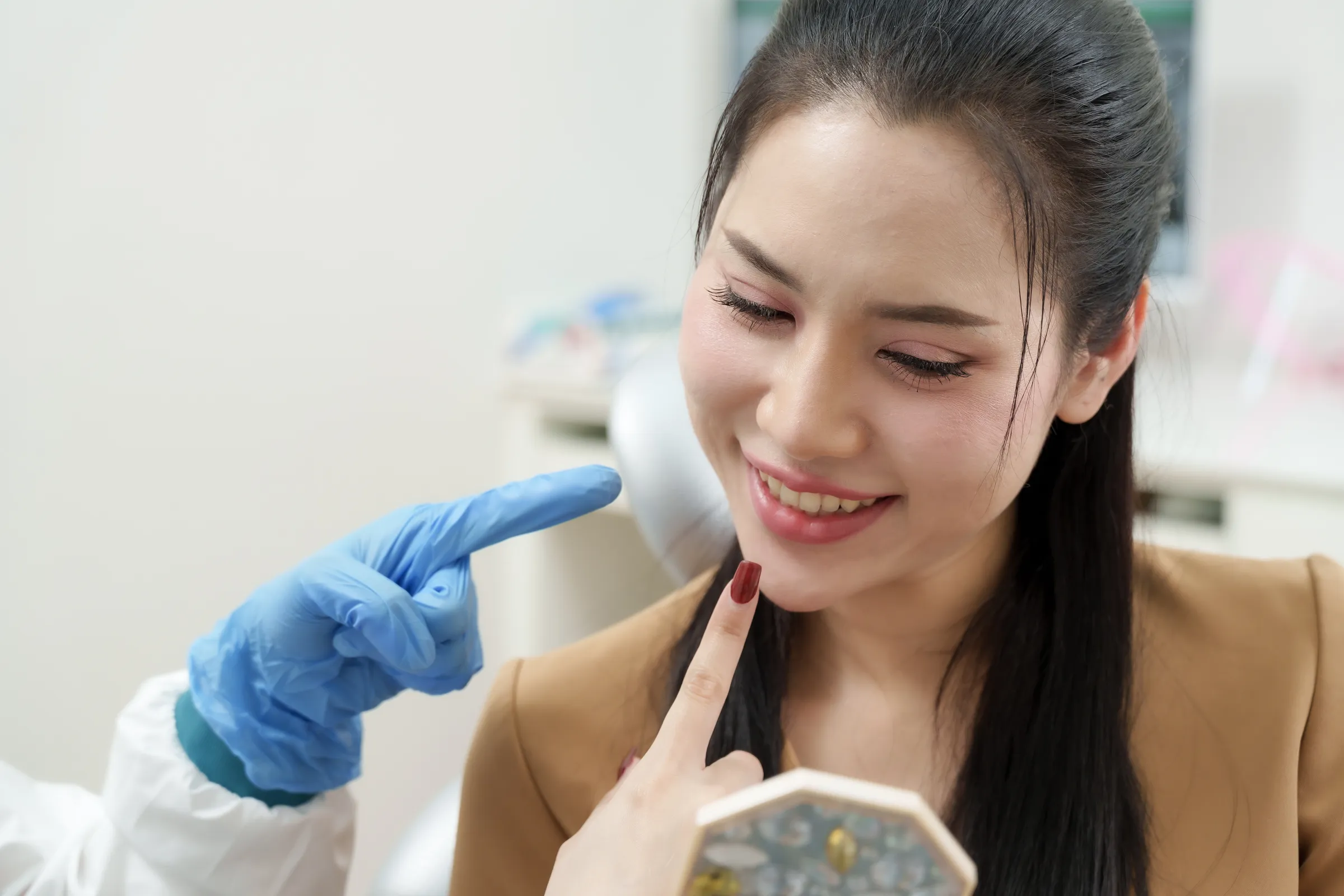 Dentist examining a patient's gum tissue