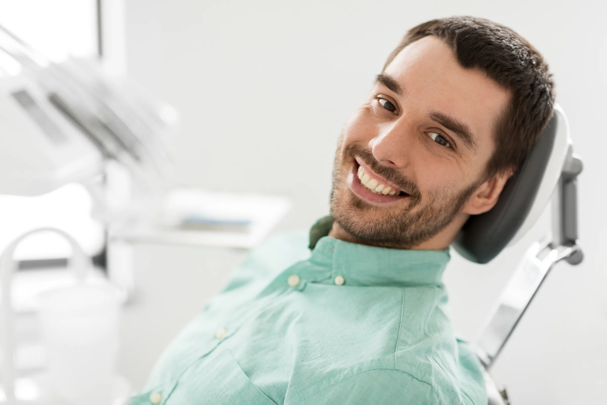 An adult patient in consultation with a clinician.