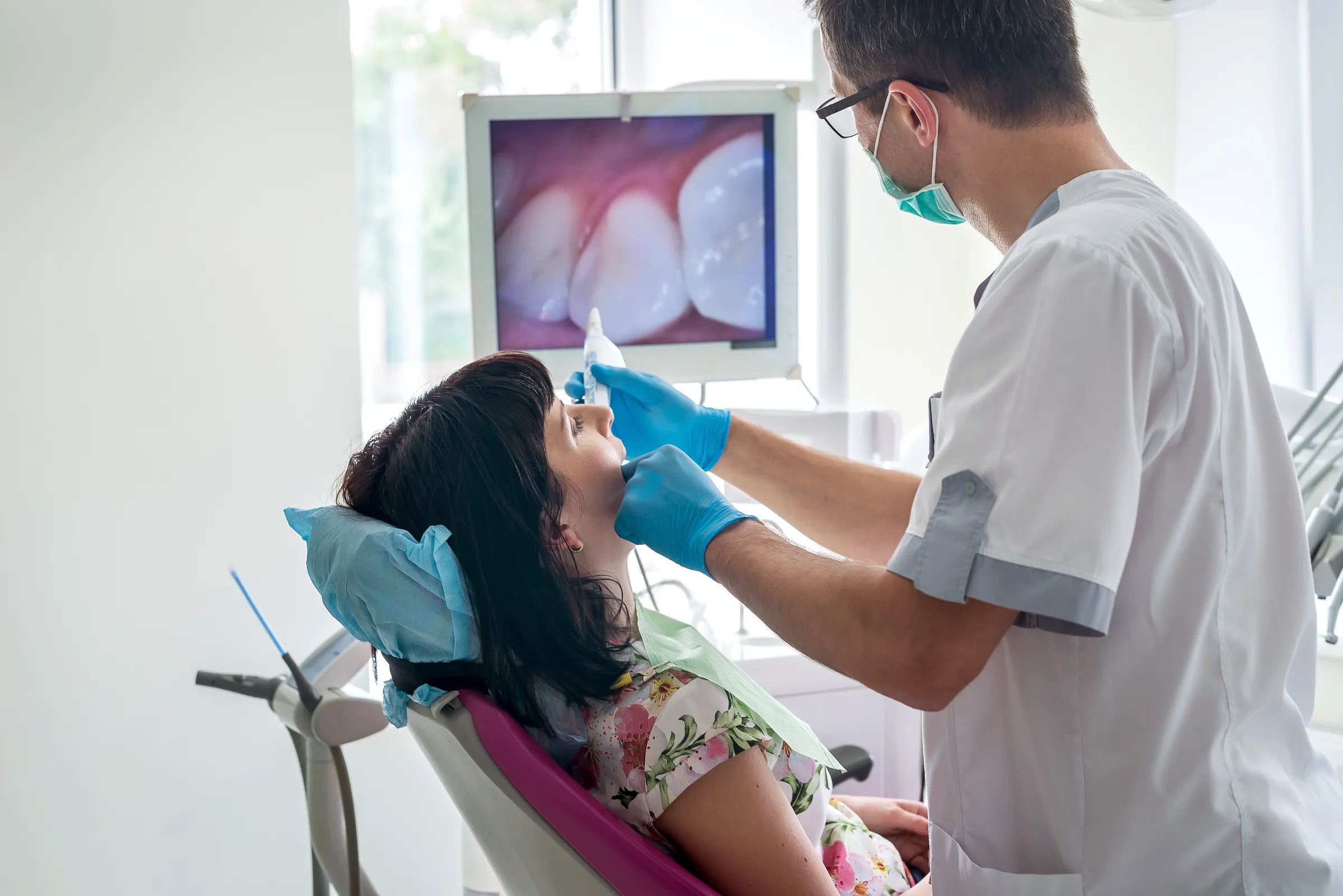 An intraoral camera image of a single tooth on the operatory screen.