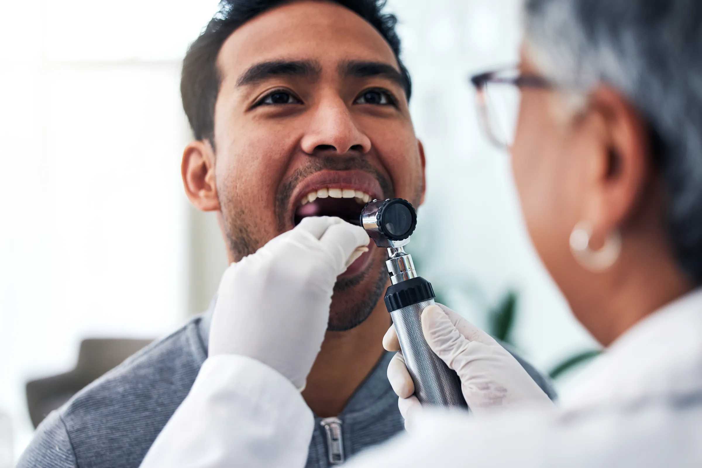 Dentist reviewing screening findings with a patient