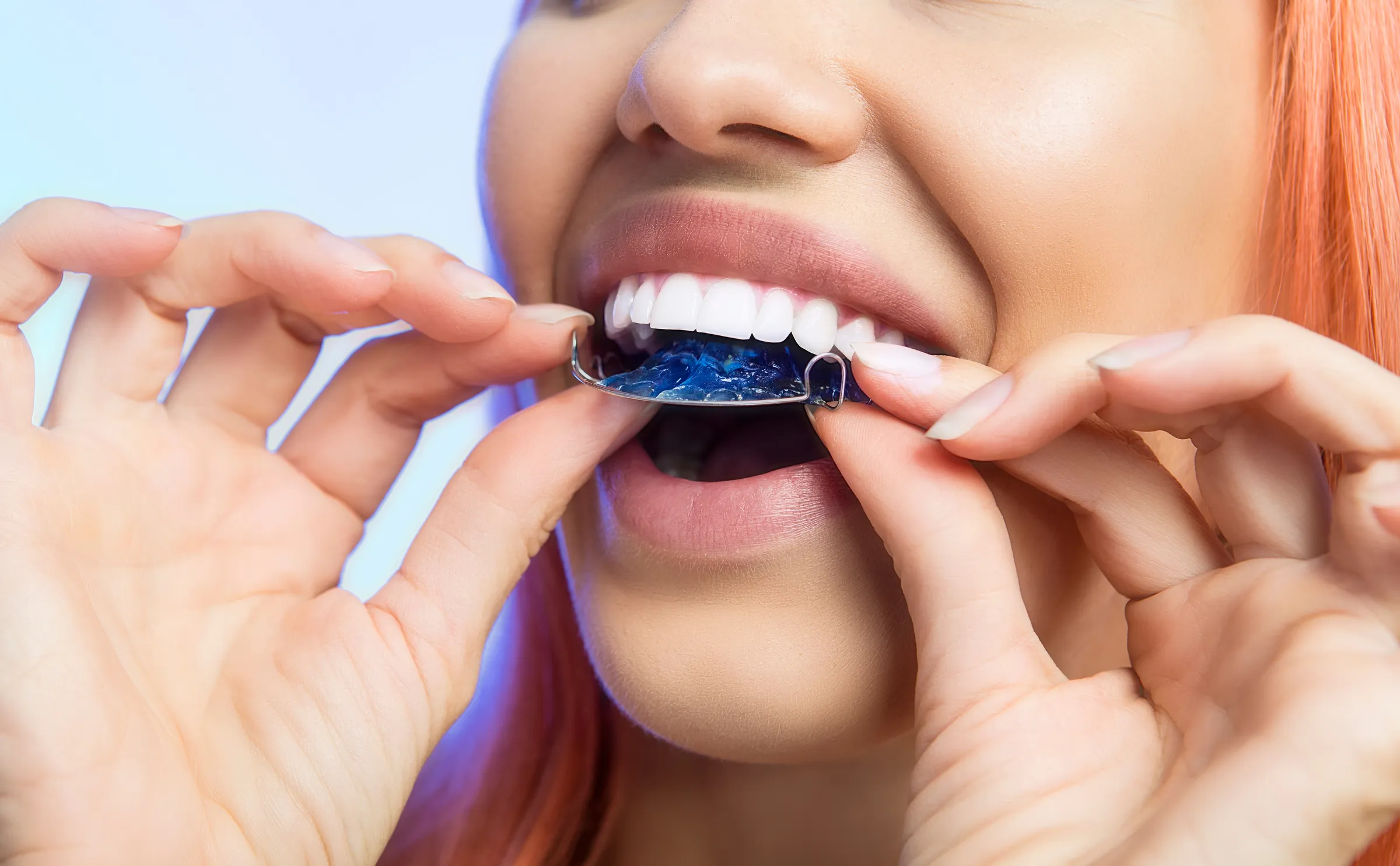 Patient holding a clear retainer