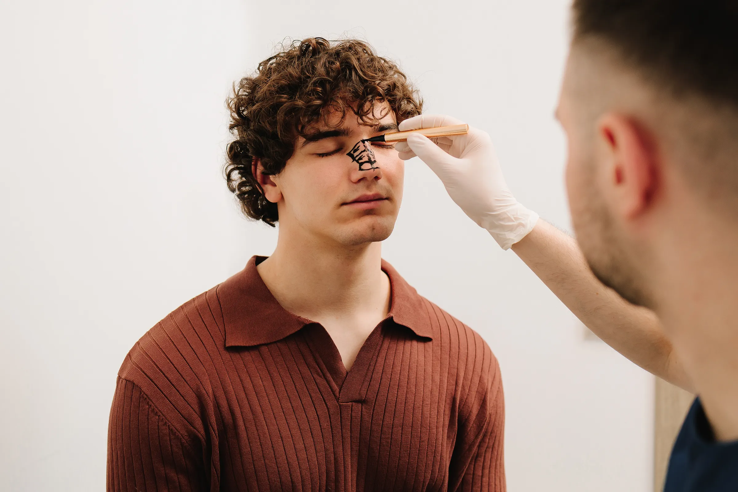 Dentist reviewing sinus imaging with a patient