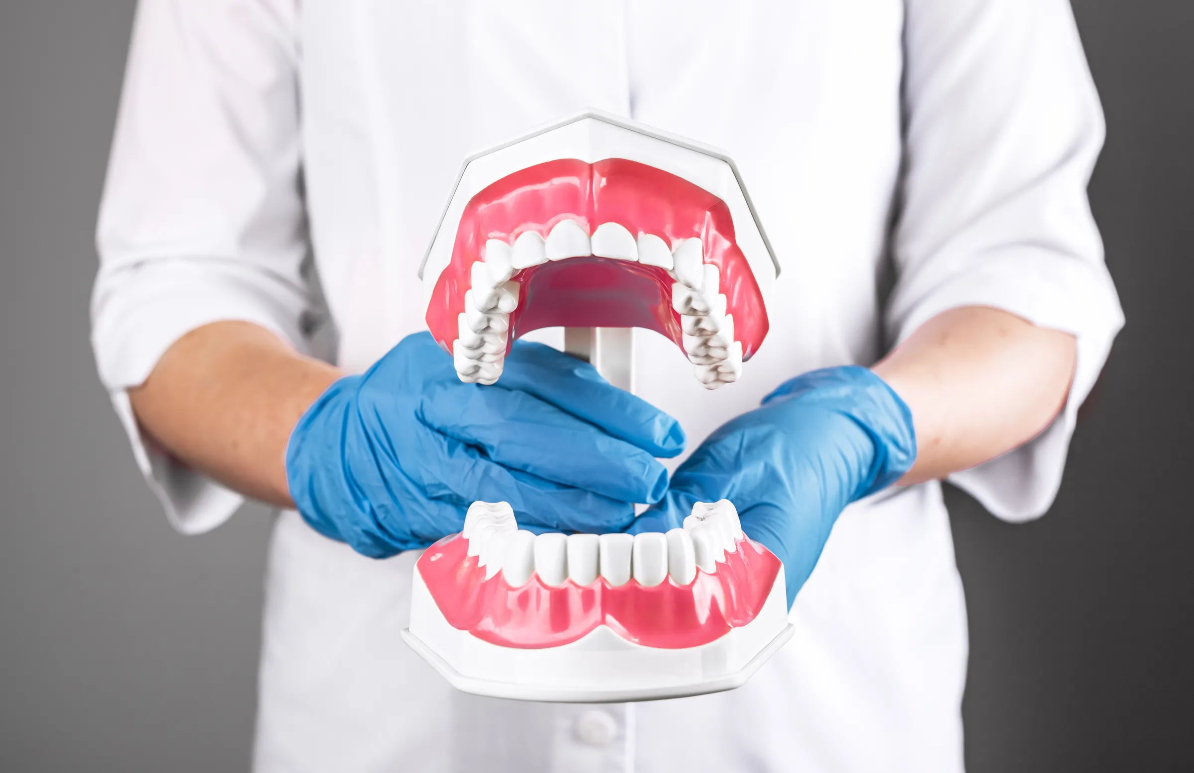 Dentist examining a patient's jaw joint