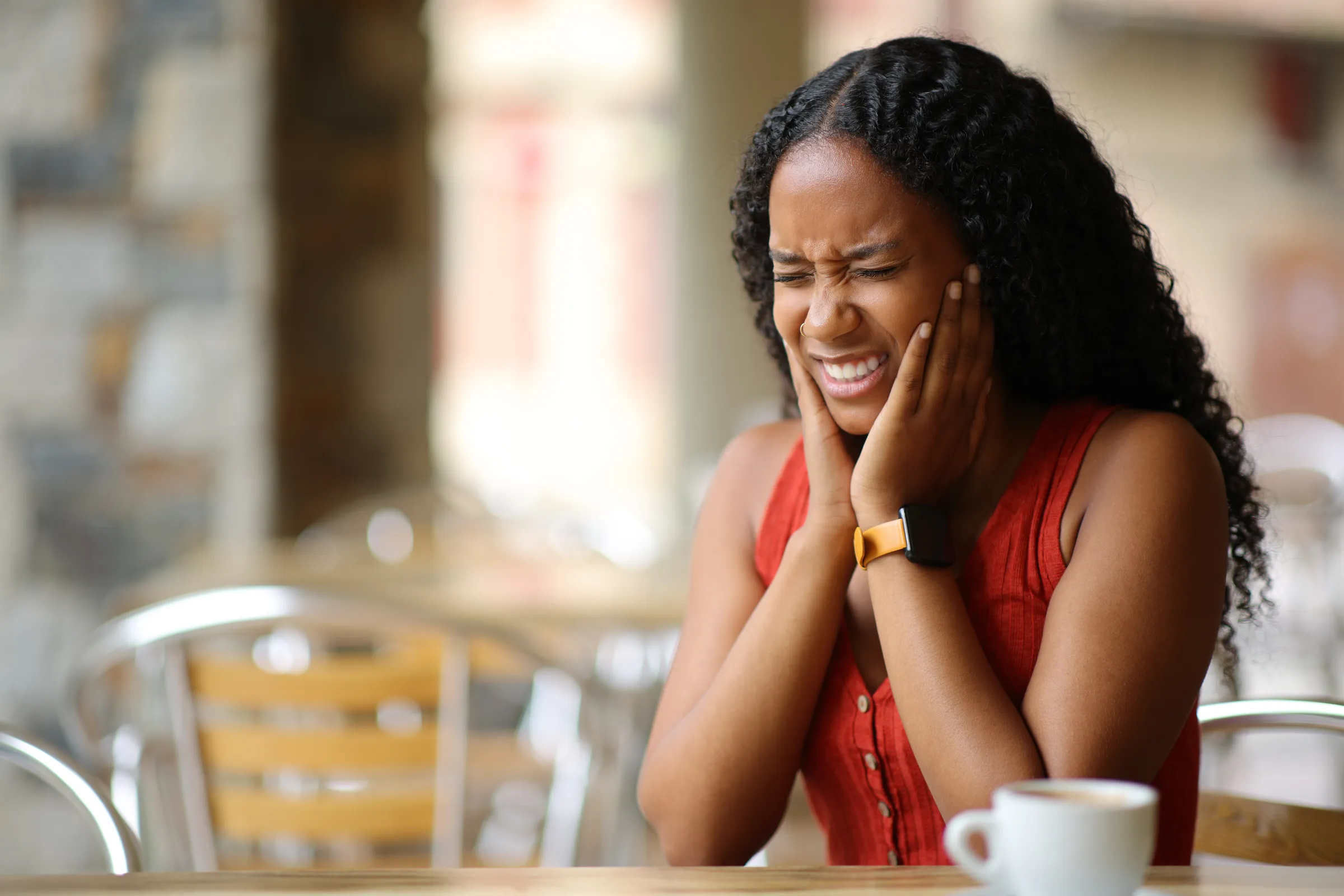 Patient with jaw discomfort receiving guidance from a dentist
