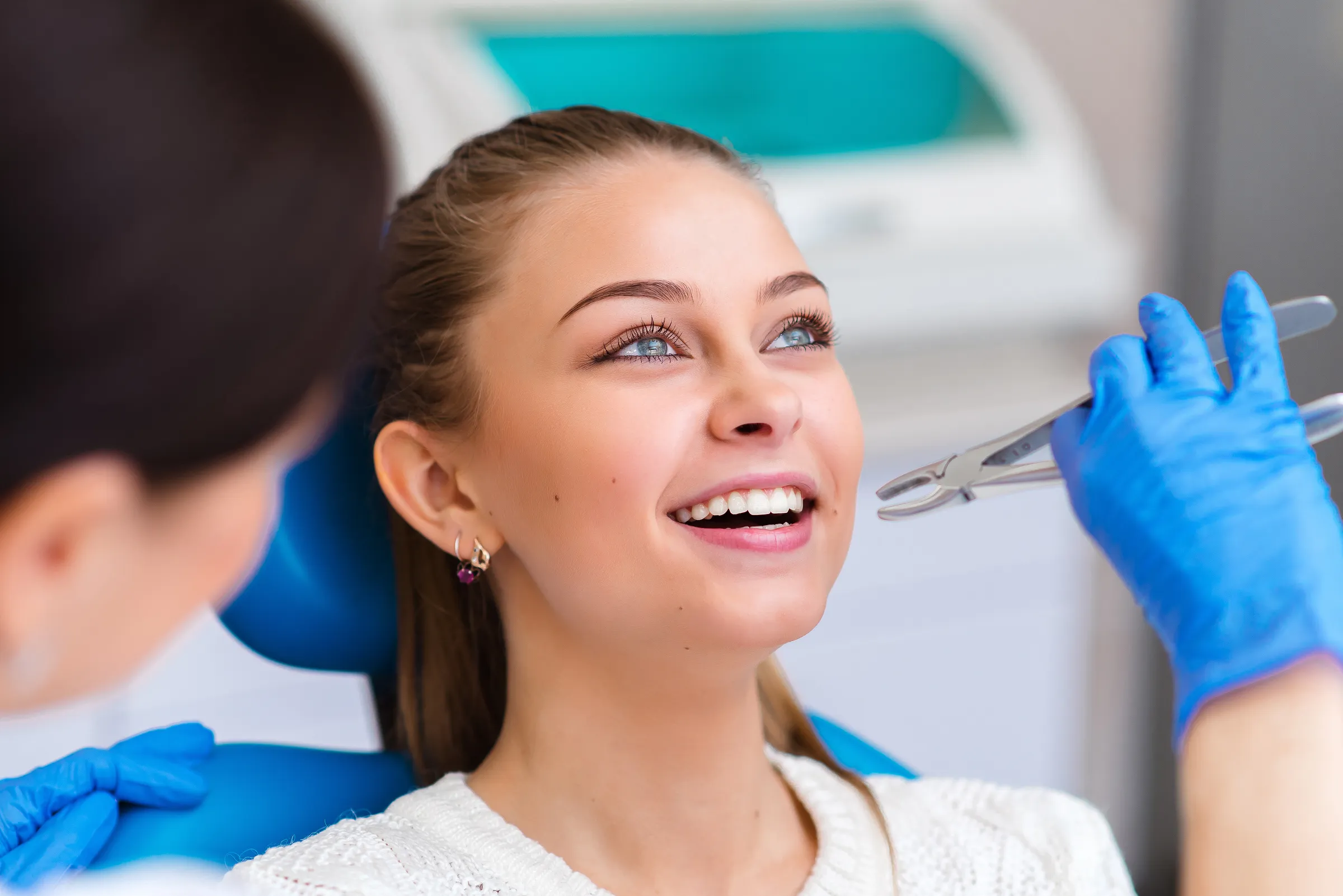 Dentist reviewing wisdom tooth imaging with a patient