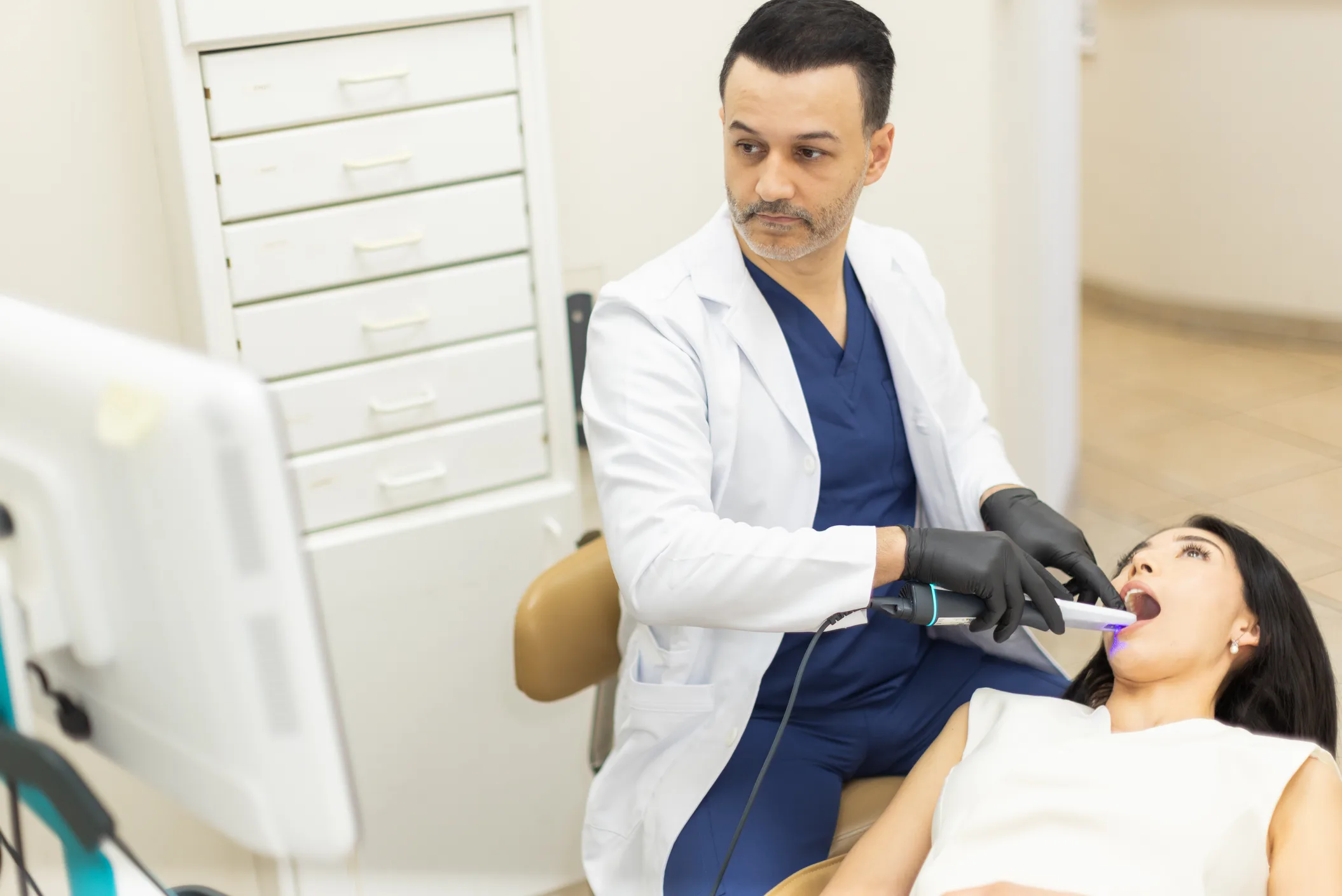 Dr. Poria Edalat treating a patient in the operatory