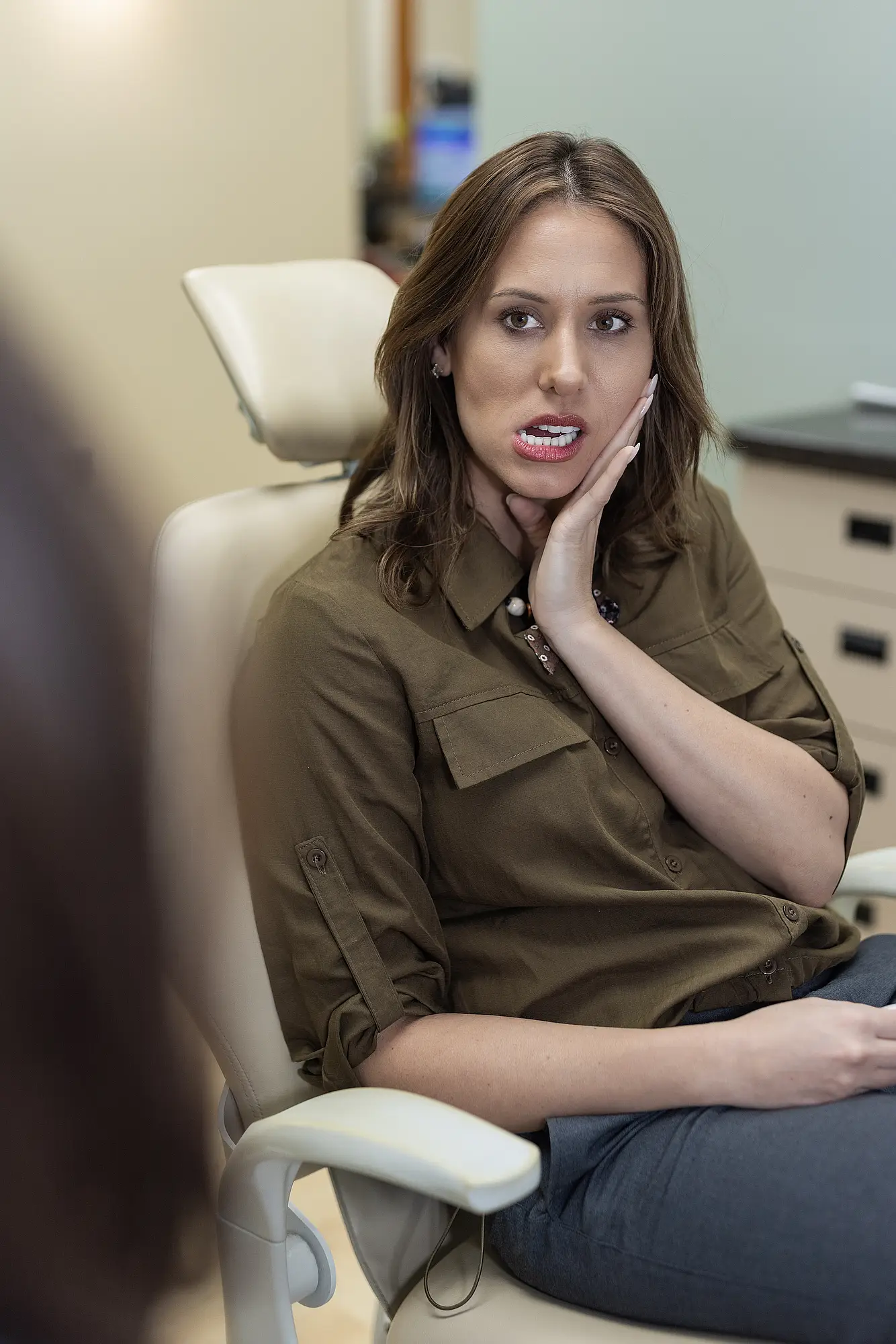 Dentist examining a patient's jaw joint