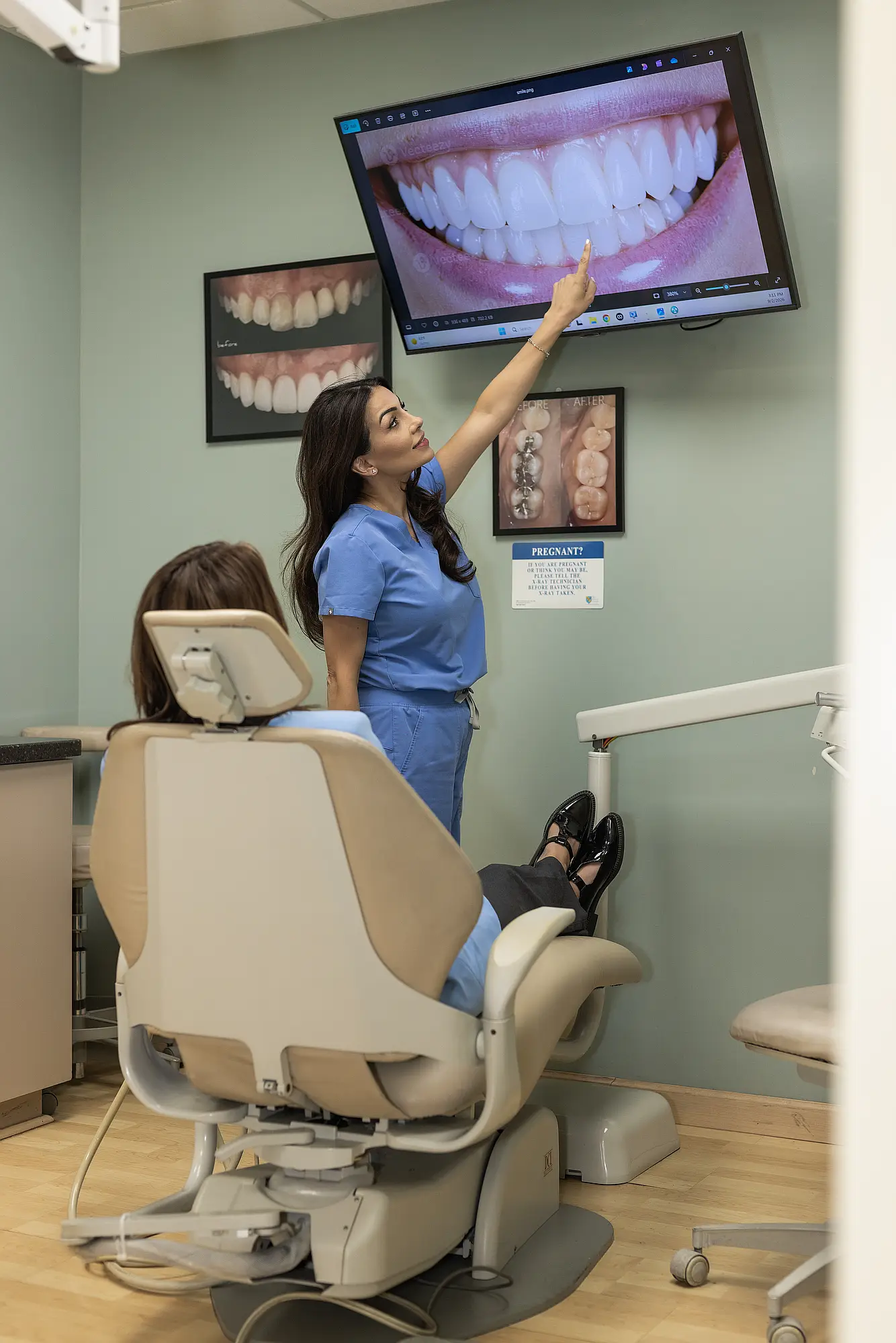 Dentist reviewing periodontal imaging with a patient