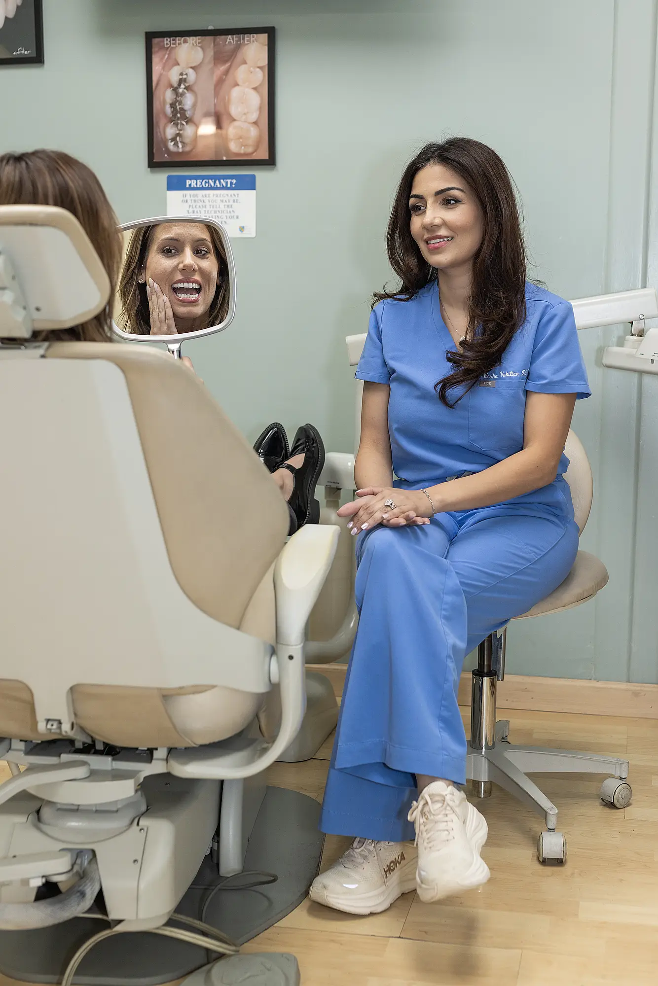 Dentist evaluating a patient's denture fit